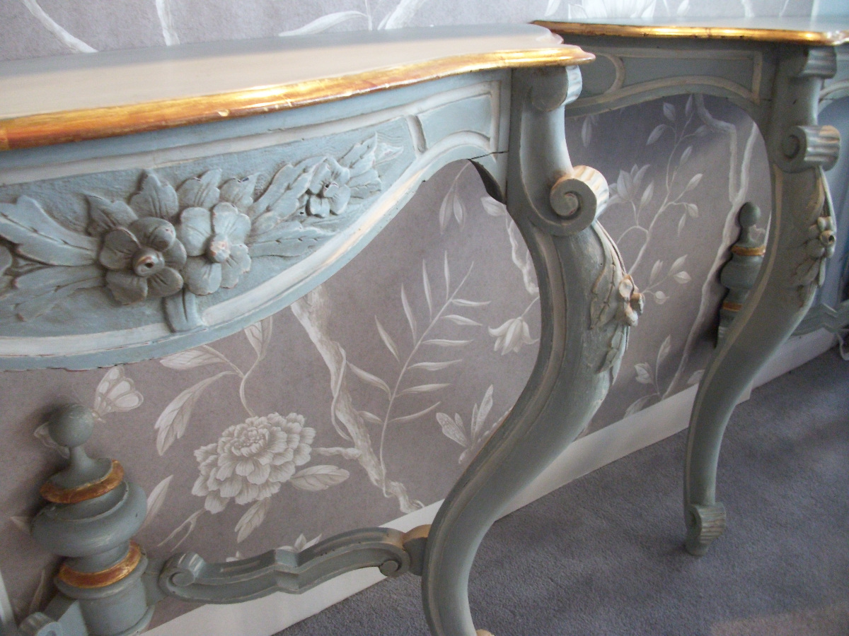 a pair of antique painted console tables